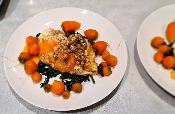 fried eggs on a bed of kale and celeriac with baby french carrots.jpg