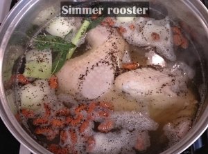 rooster in pot with herbs simmering.jpg